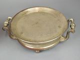 pair of silverplated dishes with handles and handles on a table