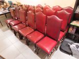 many red leather chairs lined up in a row