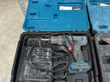 two tools sitting in a case on a pallet
