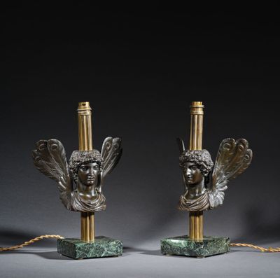 pair of bronze and marble lamps with angel heads on marble bases