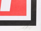 a black and white picture of a red and white square