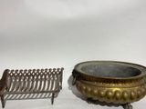 pair of antique cast iron planters and a cast iron bench