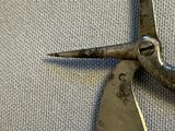 a close up of a pair of scissors on a cloth