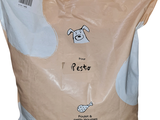 a bag of dog food sitting on a white surface