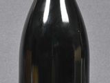 a bottle of wine that is sitting on a table