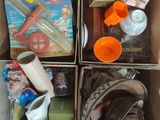 boxes filled with assorted items sitting on top of a floor
