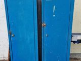 two blue lockers sitting next to each other in a room