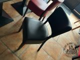 two chairs sitting next to each other in a restaurant