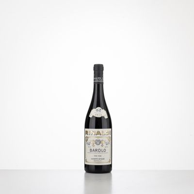 a bottle of wine sitting on top of a table