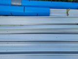 a lot of blue pipes stacked on top of each other