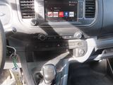 the interior of a car with a steering wheel and dashboard controls