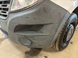 the front bumper of a car with a denting dent on it