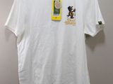 a white t - shirt with a picture of a man and a dog on it