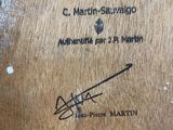 the back of a wooden box with a drawing of a man holding a baseball bat