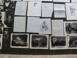 several black and white pictures of people and animals on a wall