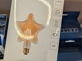 a box with a light that has a picture of a star on it