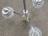 a close up of a metal pole with wheels on it