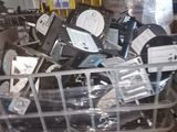 a pile of electronic equipment sitting in a metal basket