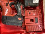an image of a red tool box with tools in it
