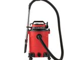 a red vacuum cleaner with a hose and a black handle