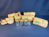 several bags of food are sitting on a table next to some bags of food