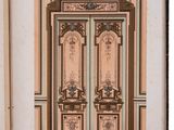 an open book with a drawing of a door and a window