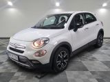 the white fiat suv is parked on a checkered floor