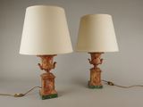 pair of lamps on a table with a lamp shade on top of them