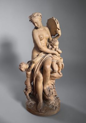 an image of a statue of a woman holding a child