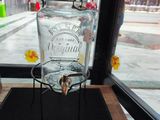 a glass jar that is sitting on a wooden table