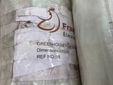 two rolls of plastic wrapped up in a warehouse