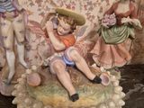 three figurines that are sitting on a table