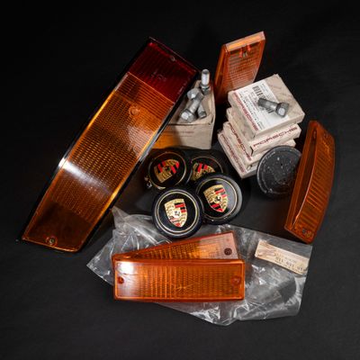 many different types of car parts on a black surface