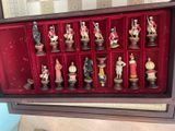 many figurines in a display case on the table