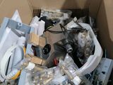 a cardboard box filled with a toilet and other items