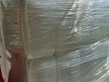 a large pile of plastic wrapped up on a pallet