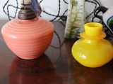 three vases sitting on a table next to each other