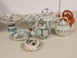 many different types of teapots and bowls on the table