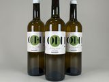 three bottles of olive oil on a white background