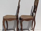 two chairs that are sitting next to each other