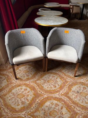 two chairs and a table in the corner of a room