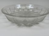 a glass bowl that is sitting on a table