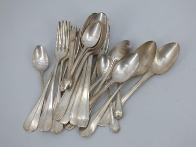 a lot of silver spoons and forks on the table