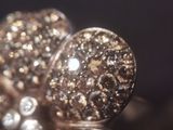 a close up of a pair of rings with diamonds on them