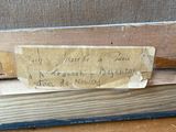 a piece of paper that has been taped to a piece of wood