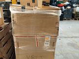 a large stack of boxes sitting on a pallet in a warehouse