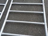 a metal ladder that is laying on the ground