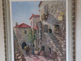 a picture of a painting on the wall above a bed