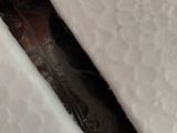 a close up of a person ' s shoe in a bag
