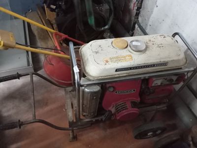a small generator that is sitting in the corner of a room